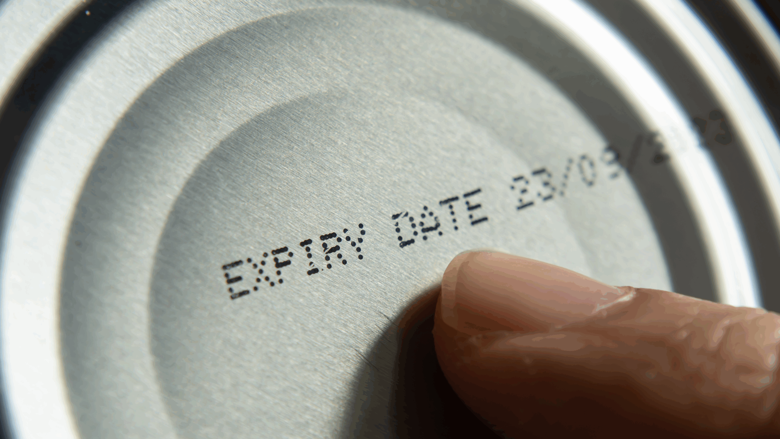 reading expiration date on can