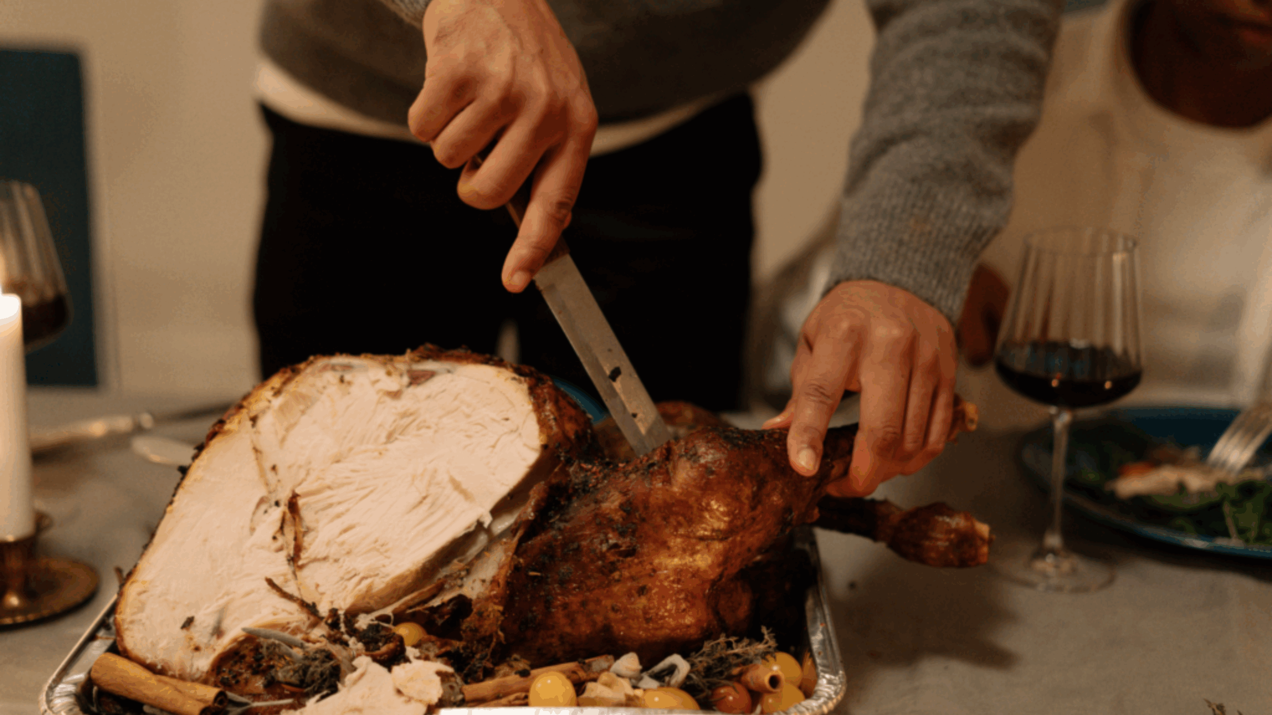 man carving Thanksgiving turkey